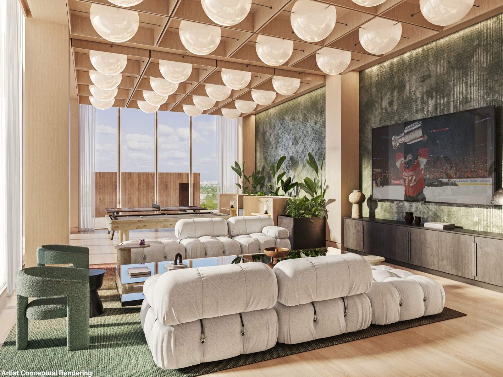 The private resident club room at Ombelle Fort Lauderdale — plush bouclé sofas under a field of globe pendants, a billiards table, and a media wall with green textured stone.