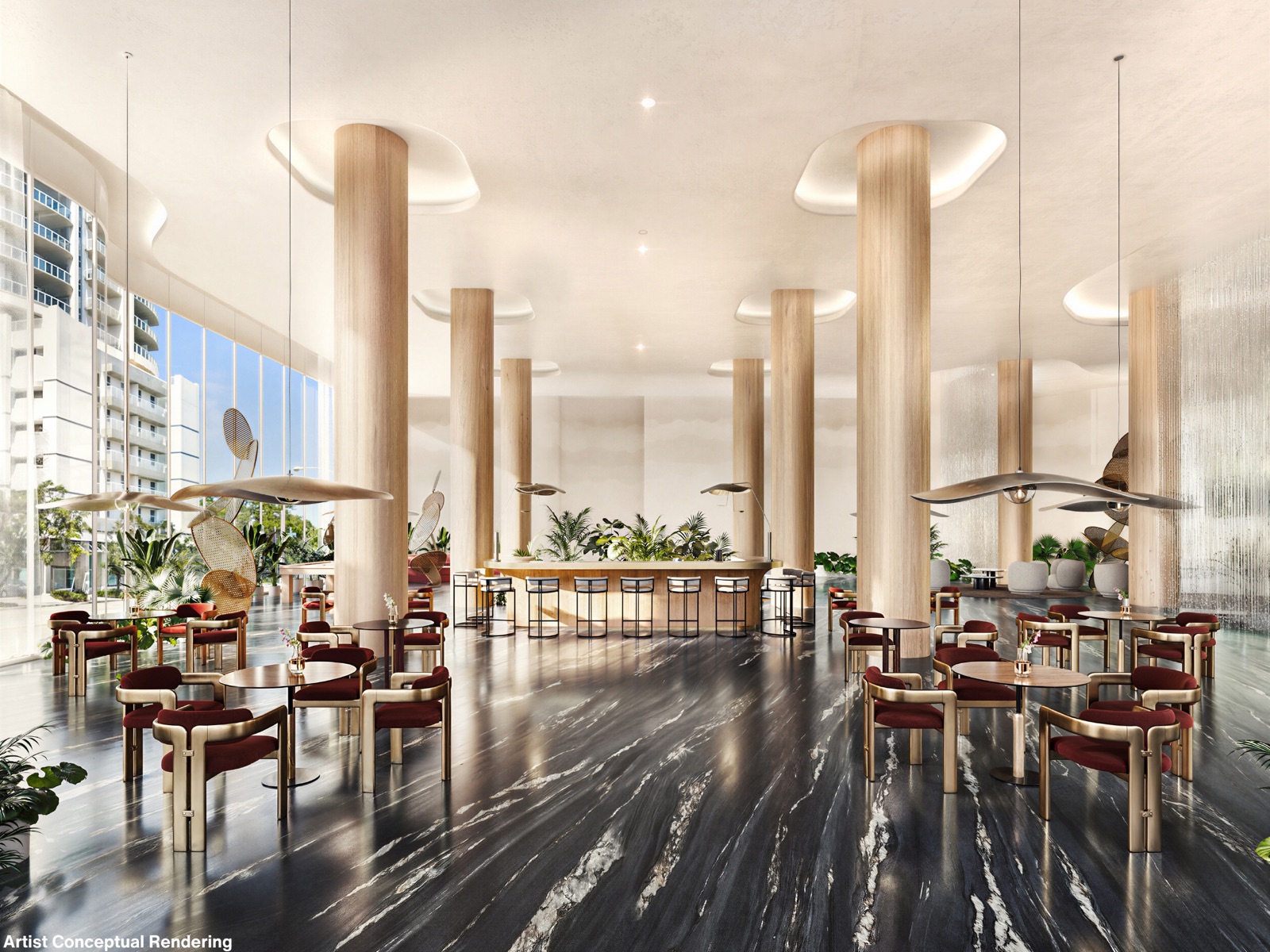 The signature dining lounge on Ombelle's ground-level plaza, The Square — black marble floors, sculpted oak columns, oxblood leather chairs, and a long bar under floating bronze light sculptures.
