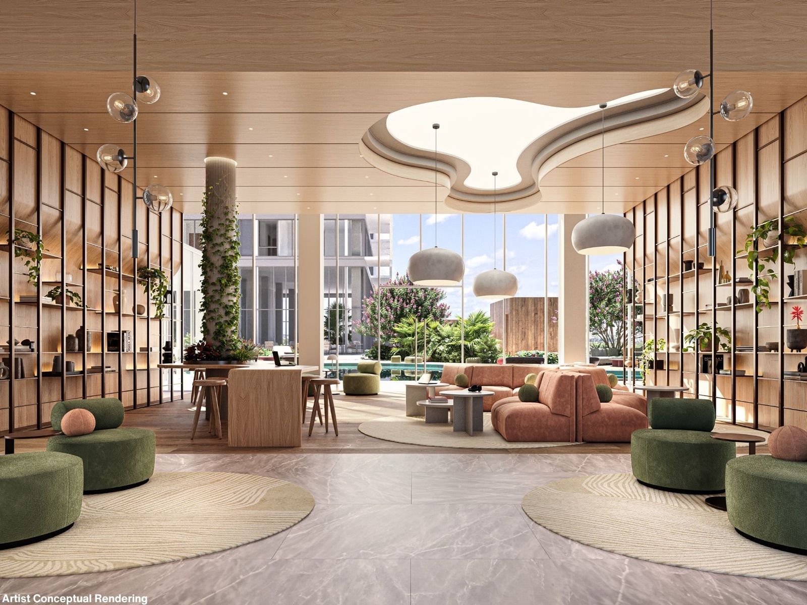 The co-working lounge and library at The Commons in Ombelle Fort Lauderdale — double-height oak shelving walls, sage and blush seating, and floor-to-ceiling glass overlooking the Sky Deck pool.