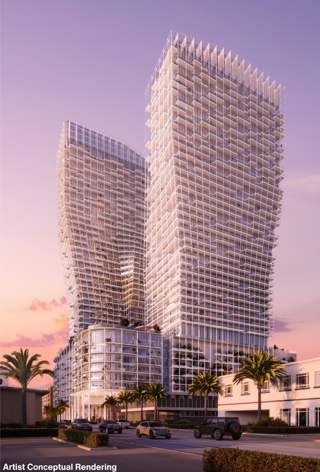 Ombelle Fort Lauderdale's two sculptural towers at rosy dusk — sweeping white architectural frames by ODA New York above a curved glass podium with palm-lined streets in Flagler Village.
